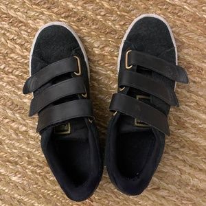 Black Puma velcro sneakers with gold hardware